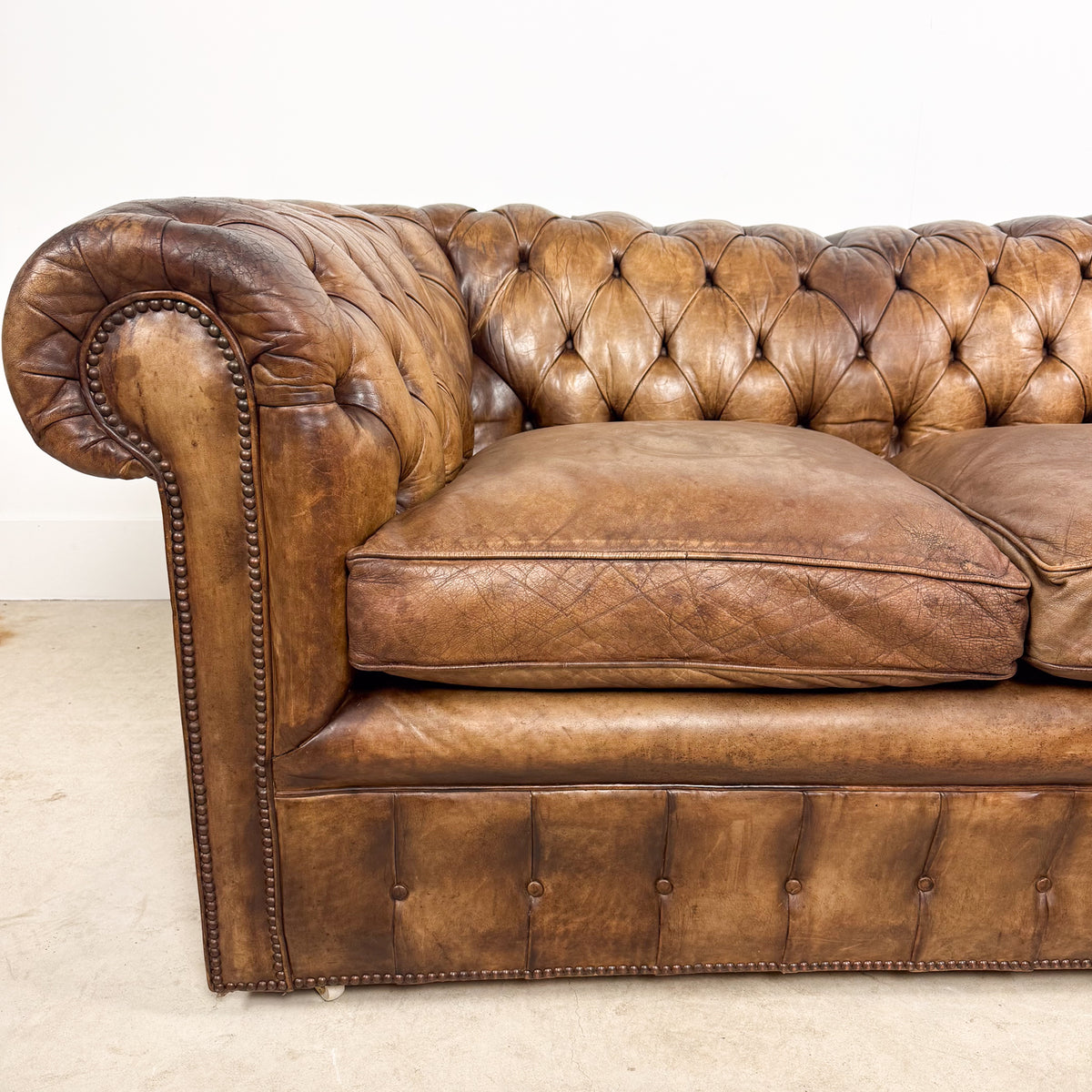 Vintage brown leather chesterfield two seater sofa