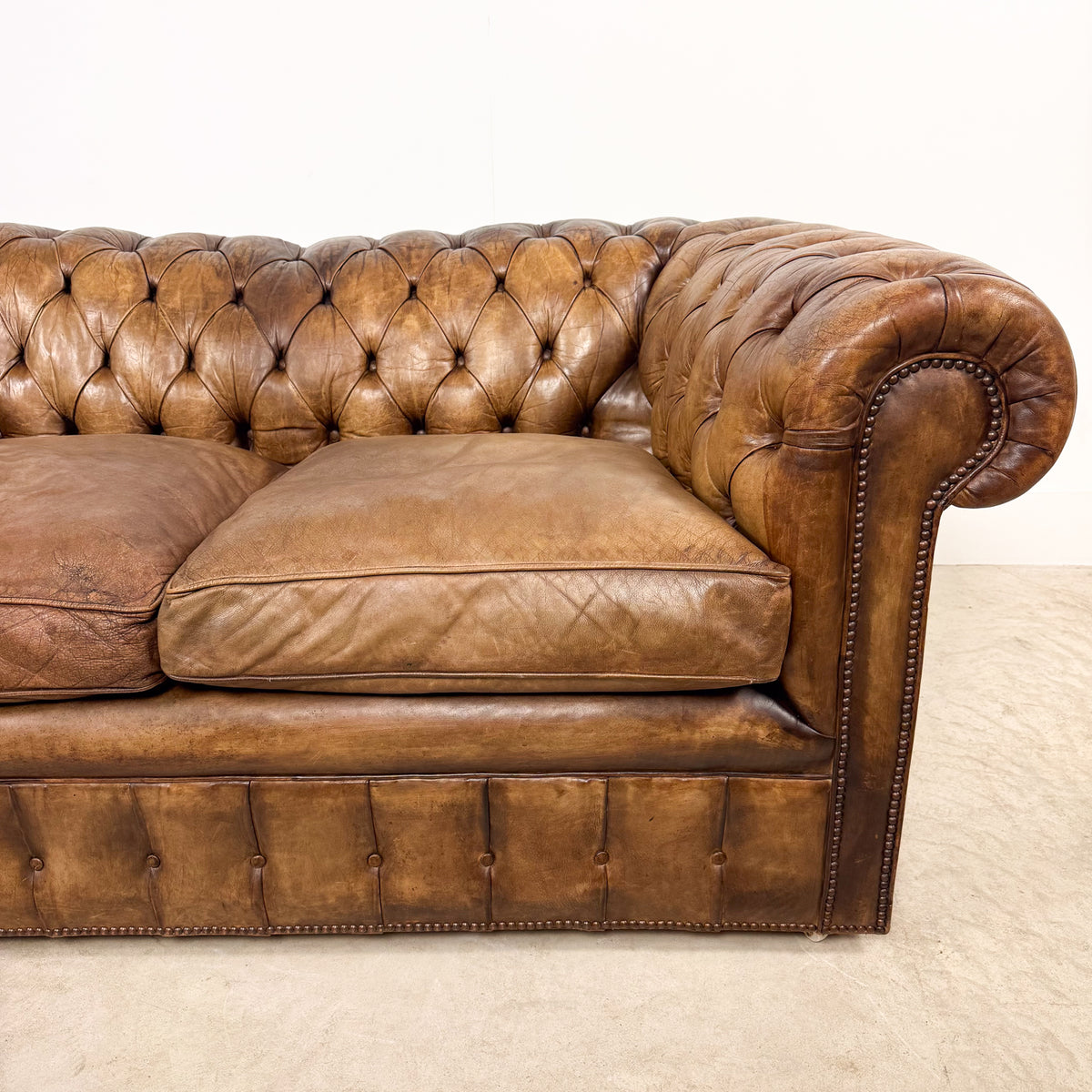Vintage brown leather chesterfield two seater sofa