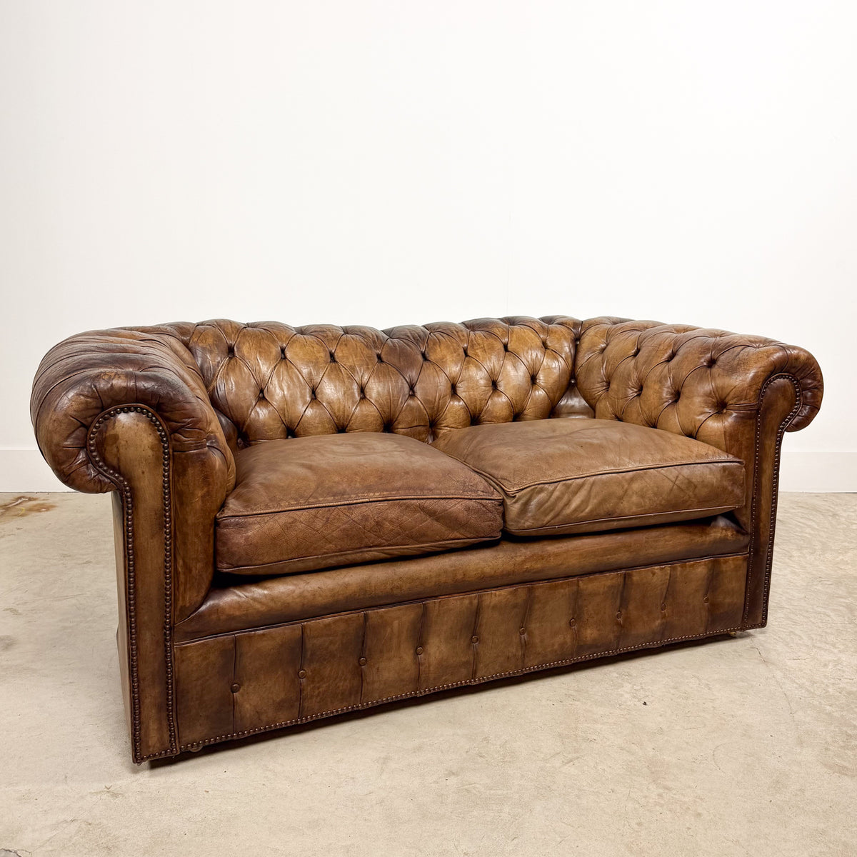 Vintage brown leather chesterfield two seater sofa