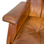 Pair of vintage cognac leather swivel lounge chairs by Eugen Schmidt