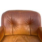 Pair of vintage cognac leather swivel lounge chairs by Eugen Schmidt