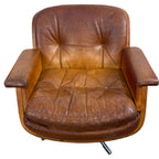 Pair of vintage cognac leather swivel lounge chairs by Eugen Schmidt