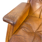 Pair of vintage cognac leather swivel lounge chairs by Eugen Schmidt