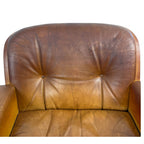 Pair of vintage cognac leather swivel lounge chairs by Eugen Schmidt