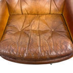 Pair of vintage cognac leather swivel lounge chairs by Eugen Schmidt