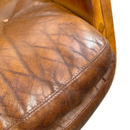 Pair of vintage cognac leather swivel lounge chairs by Eugen Schmidt