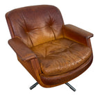 Pair of vintage cognac leather swivel lounge chairs by Eugen Schmidt