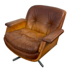 Pair of vintage cognac leather swivel lounge chairs by Eugen Schmidt