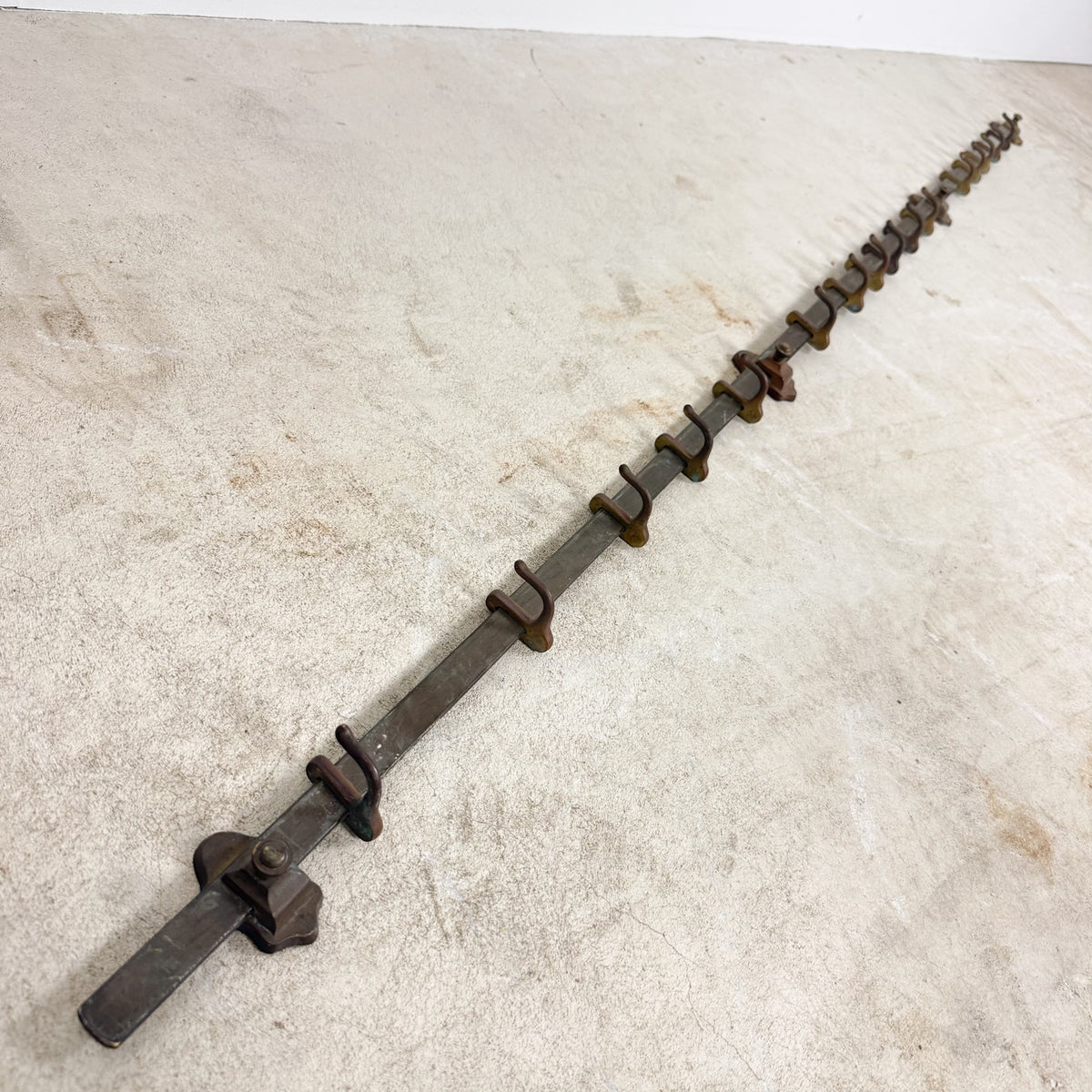 Antique industrial kitchen pot rack in copper with adjustable hooks