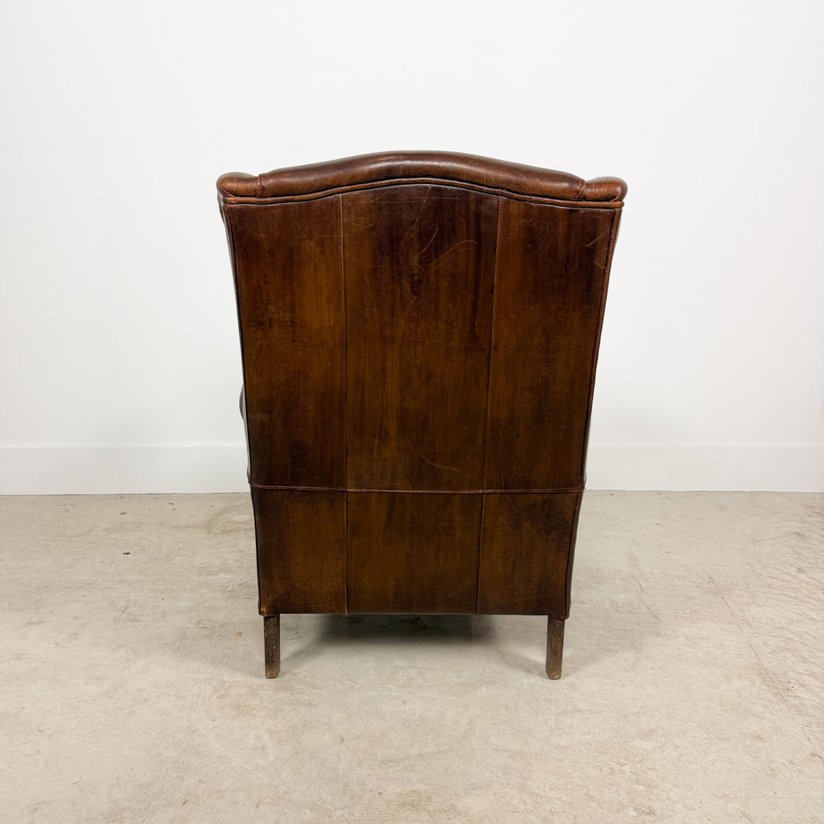 Vintage Brown Leather Wingback Armchair with Aged Patina